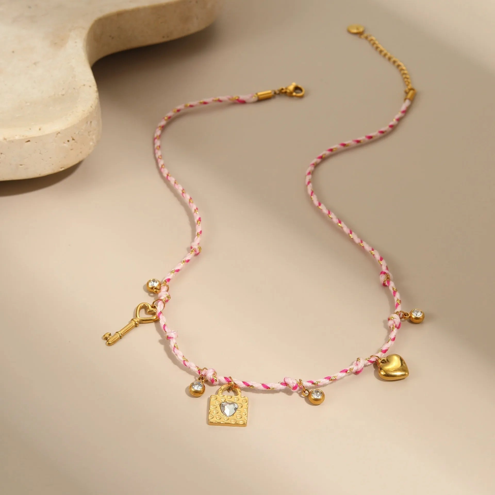 Handmade purple, pink, or blue braided rope and steel necklace or bracelet with heart, star, or geometric pendant.