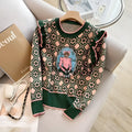 Green loose-fit women's printed sweater with regular sleeves.