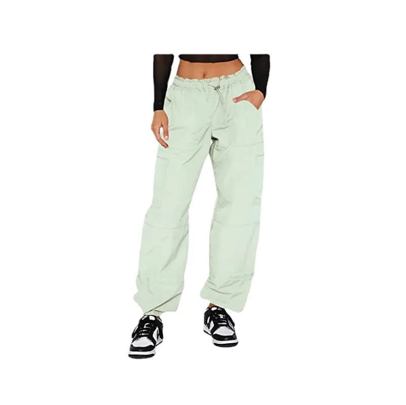 Straight-leg loose fit cargo casual pants in grey with multiple pockets, made from polyester fabric.