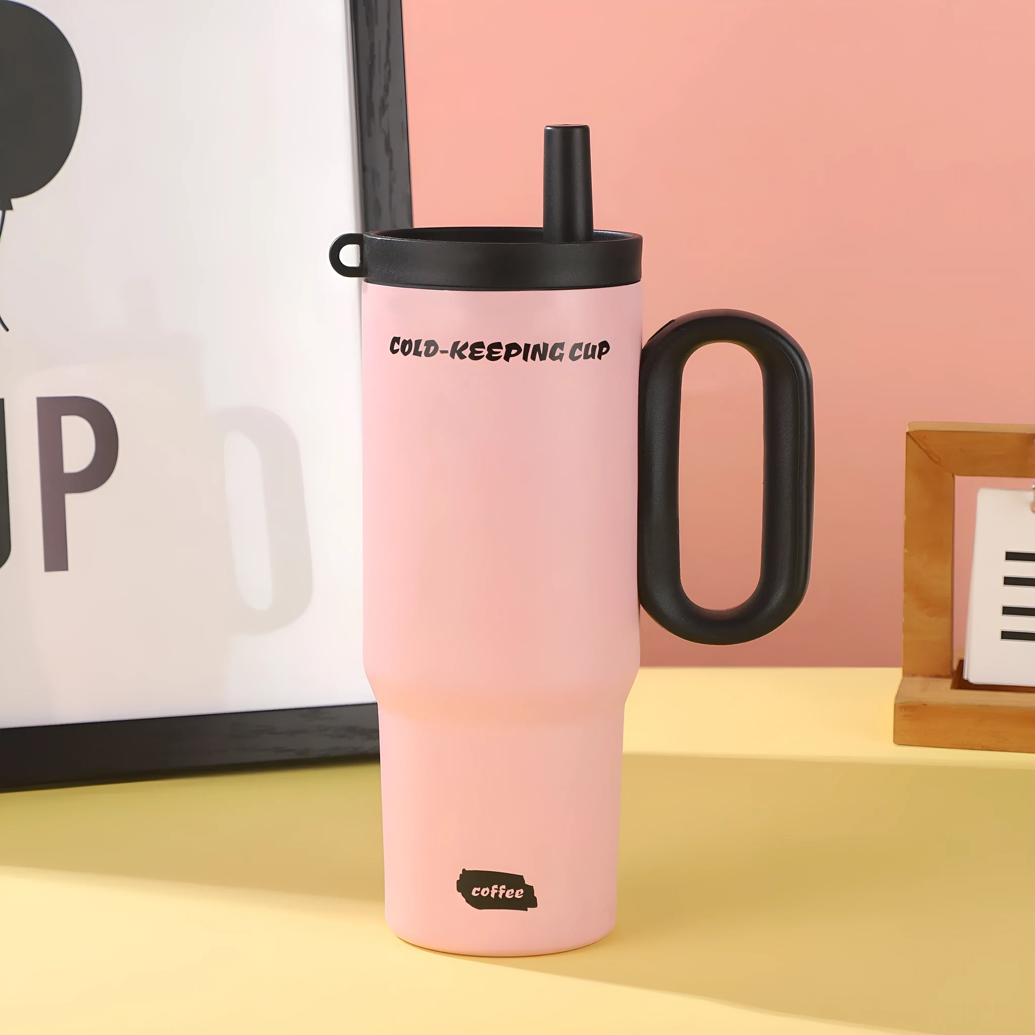 Insulated straw cup with handle in multiple colours showing 700ml capacity