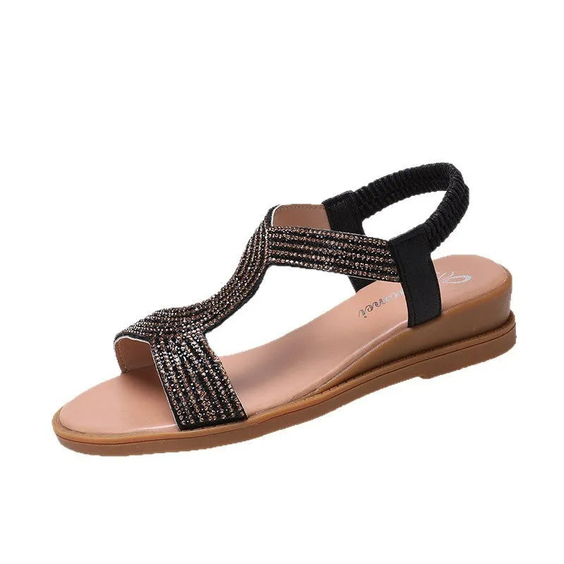 Women's patent leather beach sandals with rhinestone straps and non-slip soles in gold colour.