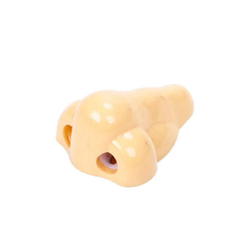 Flesh colour geometry-shaped plastic pencil sharpener with big nostril.