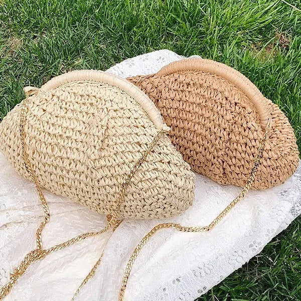 Shell-shaped women's straw bag with chain strap in khaki colour option showing zippered pocket detail