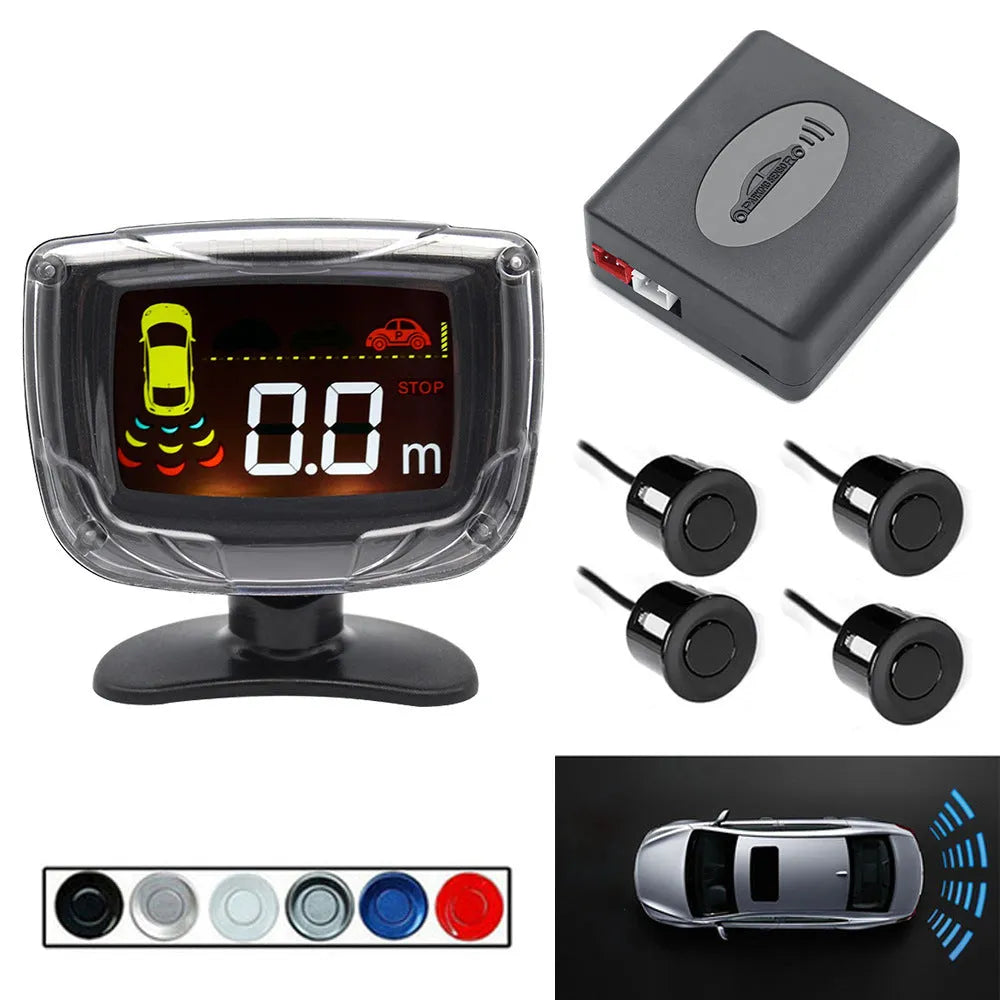 Black wireless reversing sensor kit with digital display, four round probes, power cable, and installation tools.