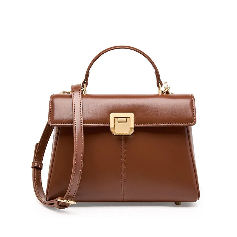 Women's black genuine leather shoulder bag with vachette clasp closure showing horizontal square design
