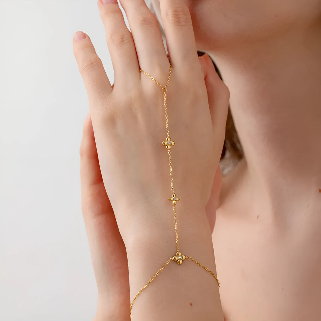 Gold stainless steel women's bracelet with eight-pointed star and floral geometric design