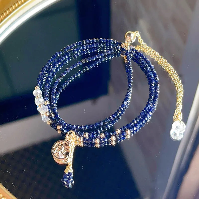Women's handmade multi-layer bracelet with blue sand stone beads on three interlocking rings