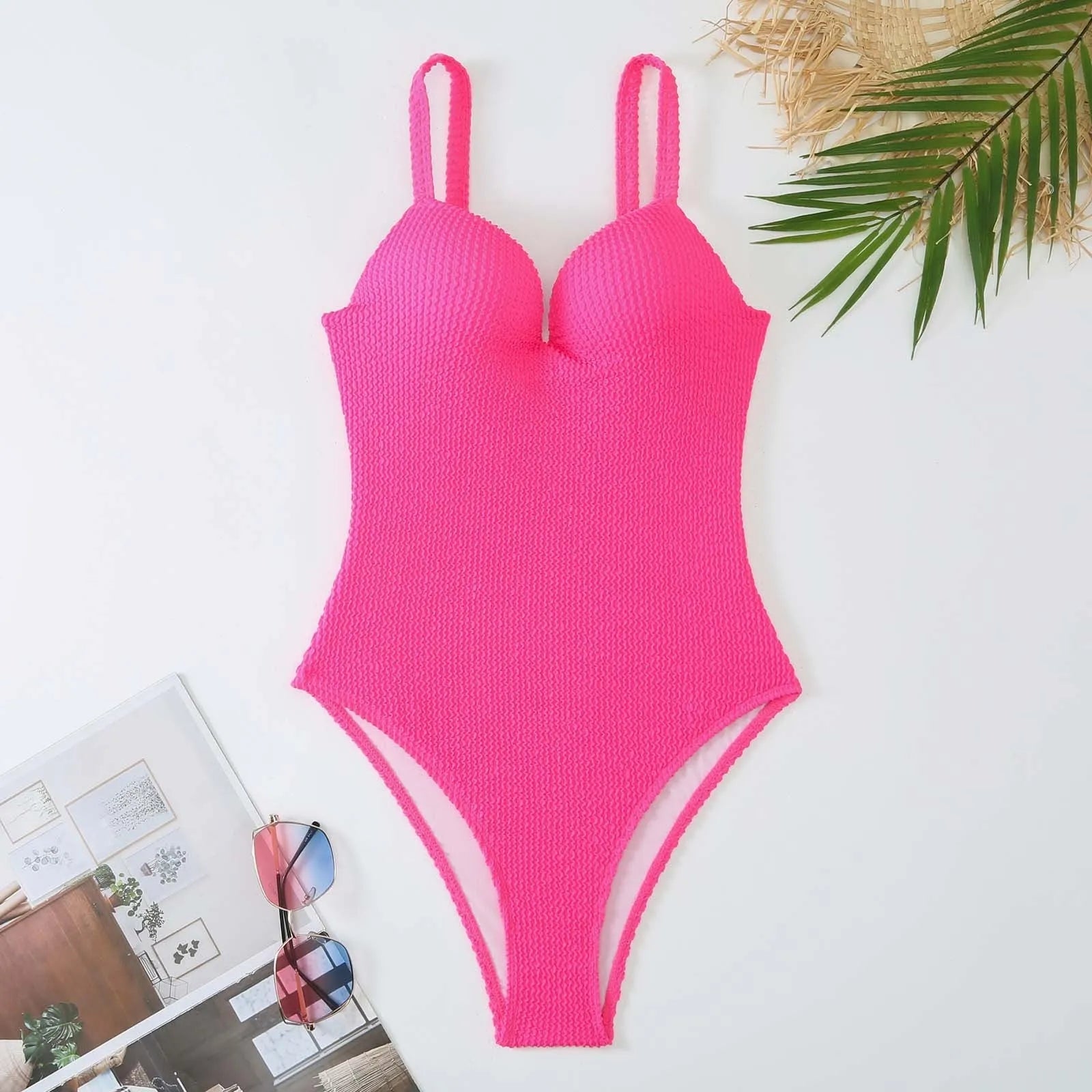 Women's black sunk-stripe one-piece swimsuit made from polyester fabric, sleeveless design.