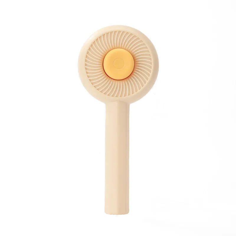 Blue pet grooming brush with metal angled needles and a self-cleaning button on the plastic handle.