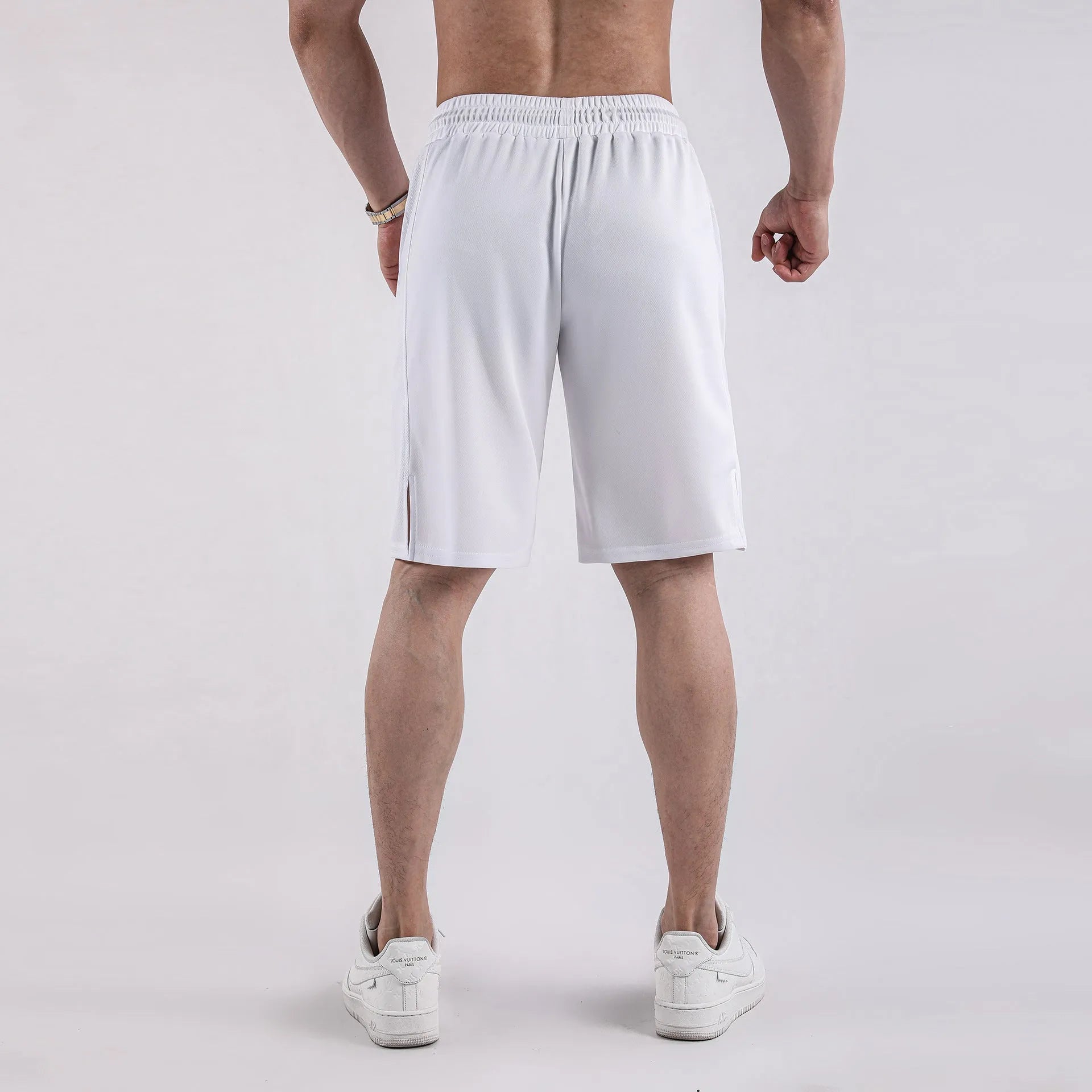 Men's black mesh fitness shorts with quick-drying fabric and mid-waist loose casual design