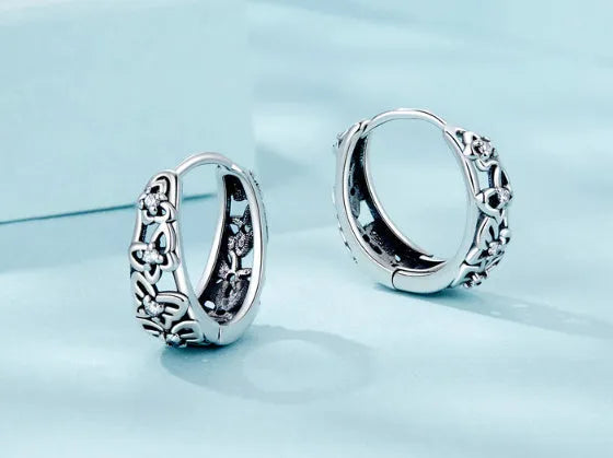 Hollow butterfly earrings in sterling silver with zircon detailing, 14mm height