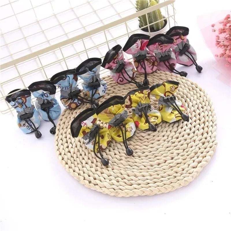 Dog shoes with soft soles in multiple colours including rose red, black, blue and monkey print designs