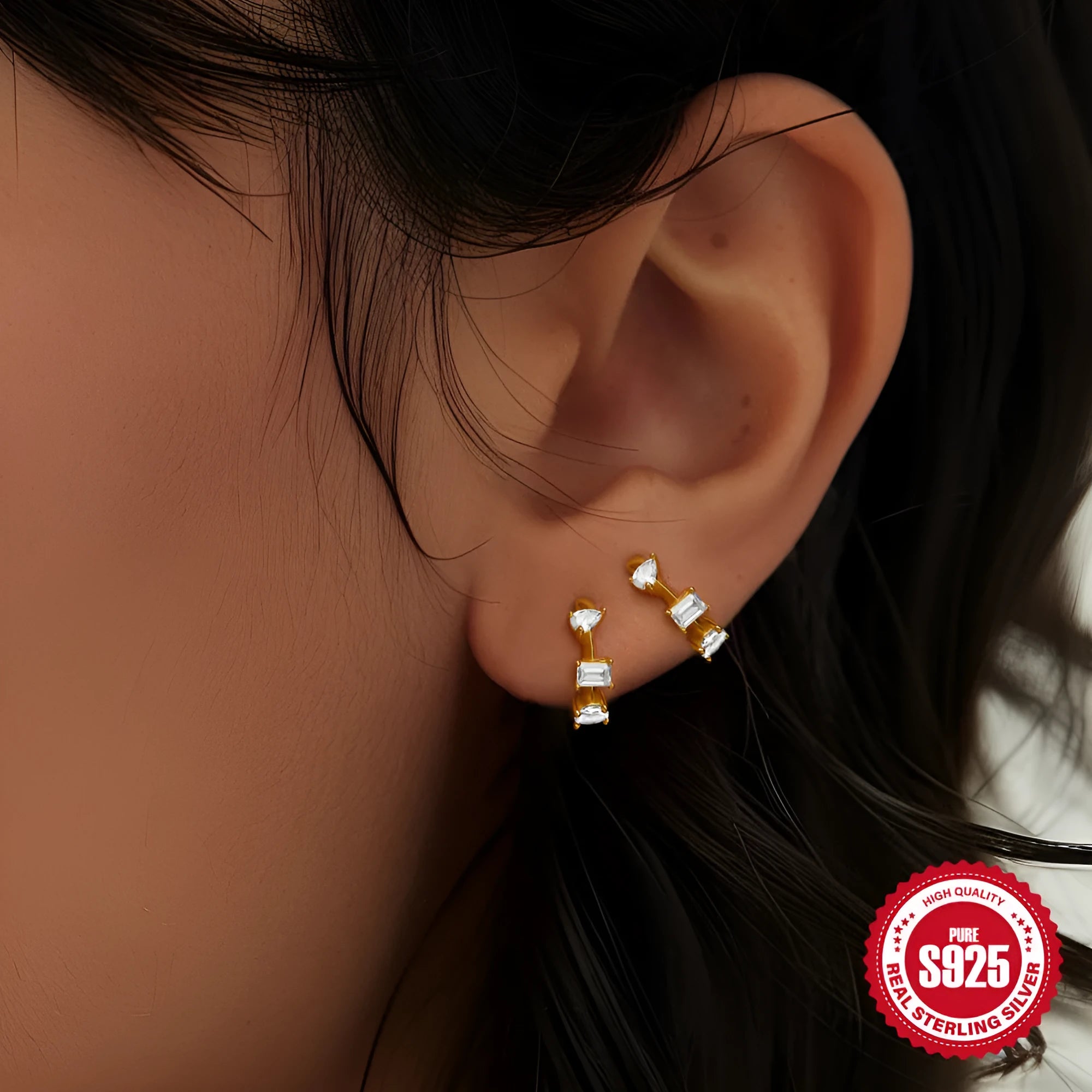 Sterling silver geometric stud earrings with a small round shape and classic diamond detail on a white background.