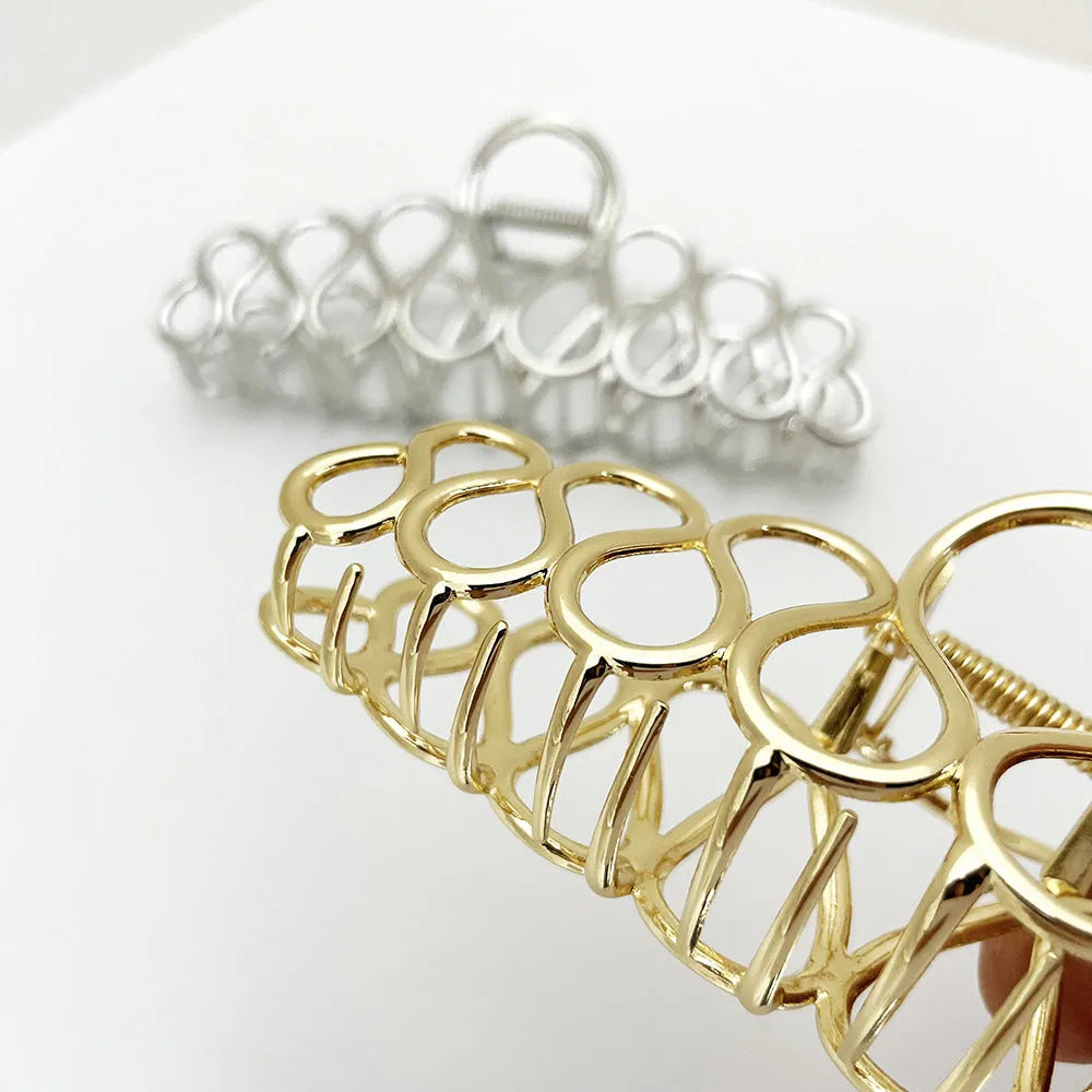 Large gold or silver alloy hair clip with minimalist design and European tassel detailing for women's updo hairstyles
