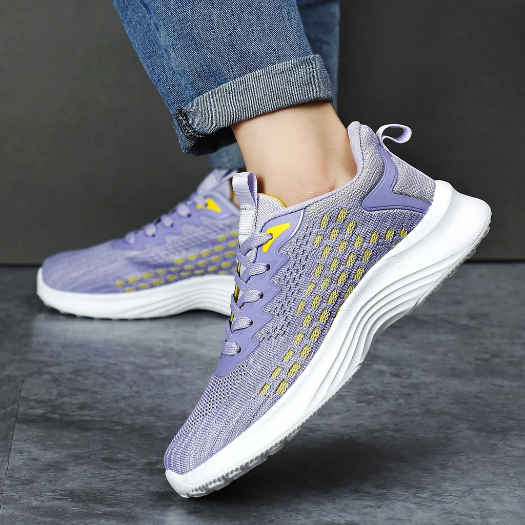 Women's lavender purple Flyknit running shoes with striped pattern and mesh design for sports