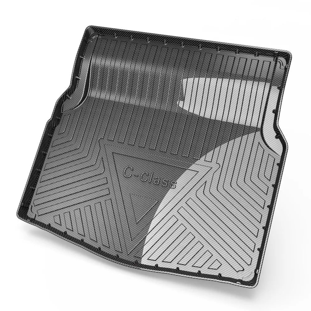 Black car trunk protection pad with a textured carbon fibre pattern, made from TPE material.