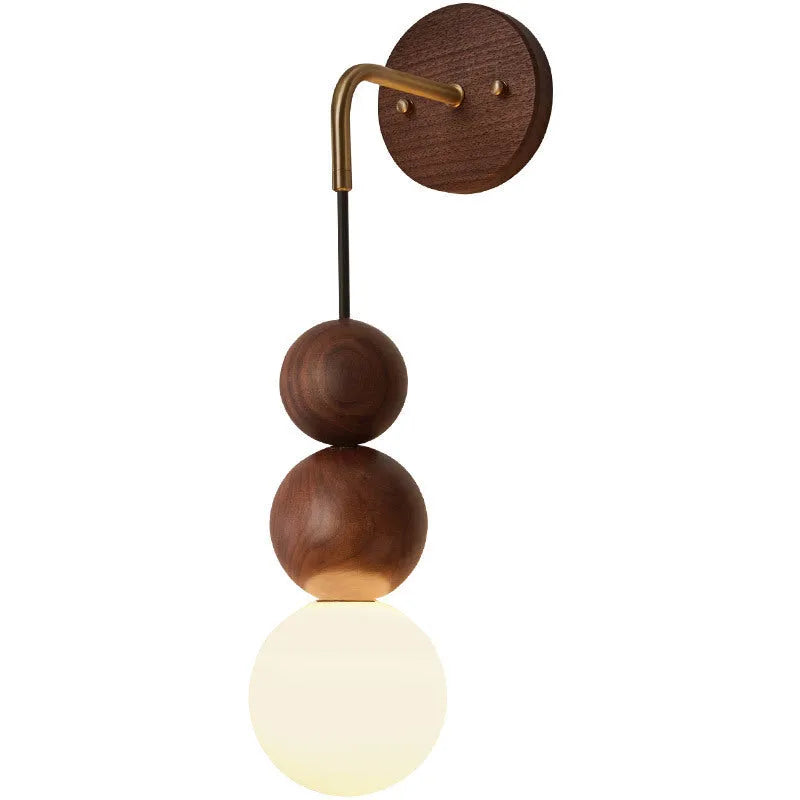 Walnut and copper suspension wall lamp with tri-colour light on a wall