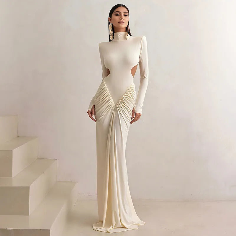 Women's slim fit high collar long sleeve dress with pleated backless detail in light apricot colour.