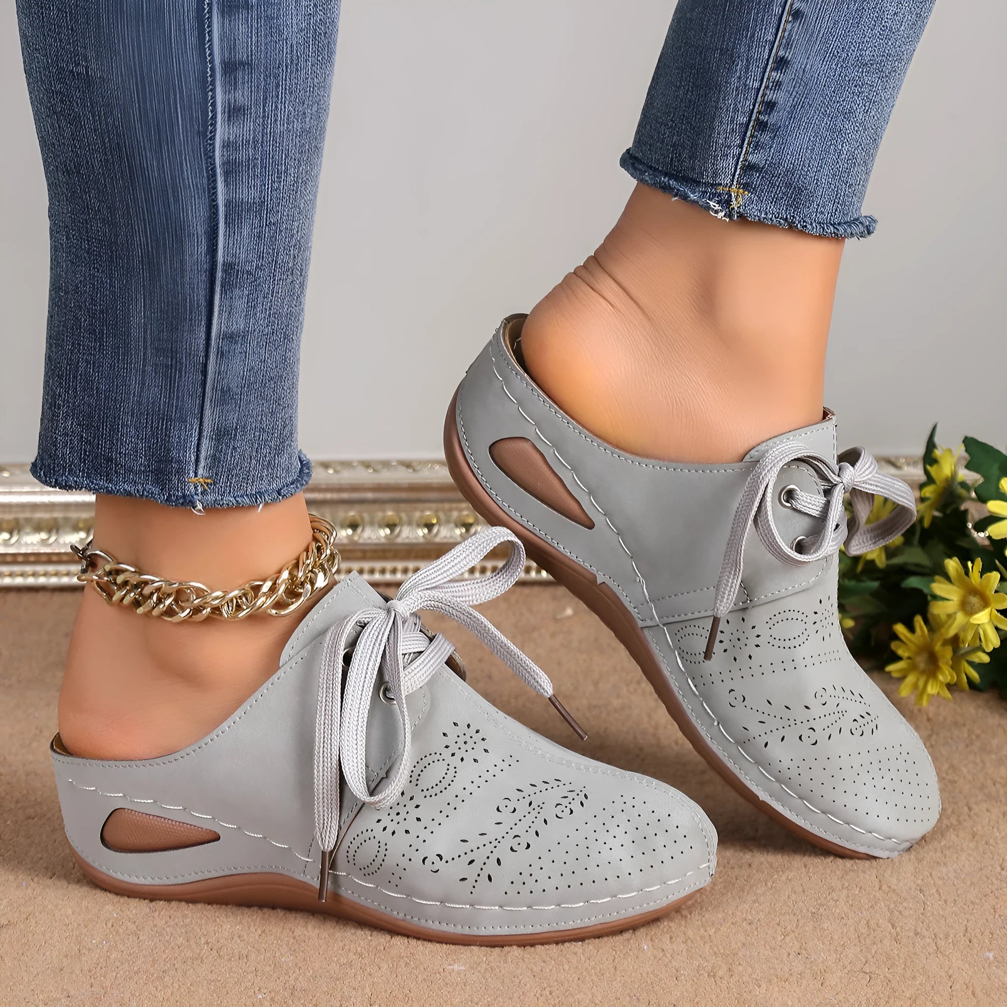 Women's black suede lace-up wedge slippers with a baotou toe and hollow out heel on a rubber sole.
