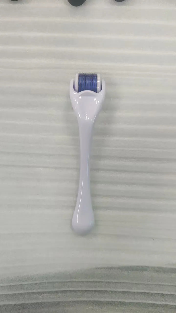 Black handle micro needle roller with purple wheel showing 540 stainless steel needles for dermaplaning