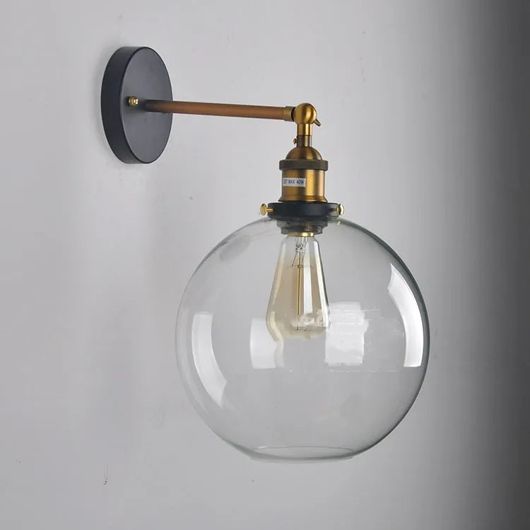 Retro round glass ball wall lamp in amber finish with 20cm diameter and aluminium holder.