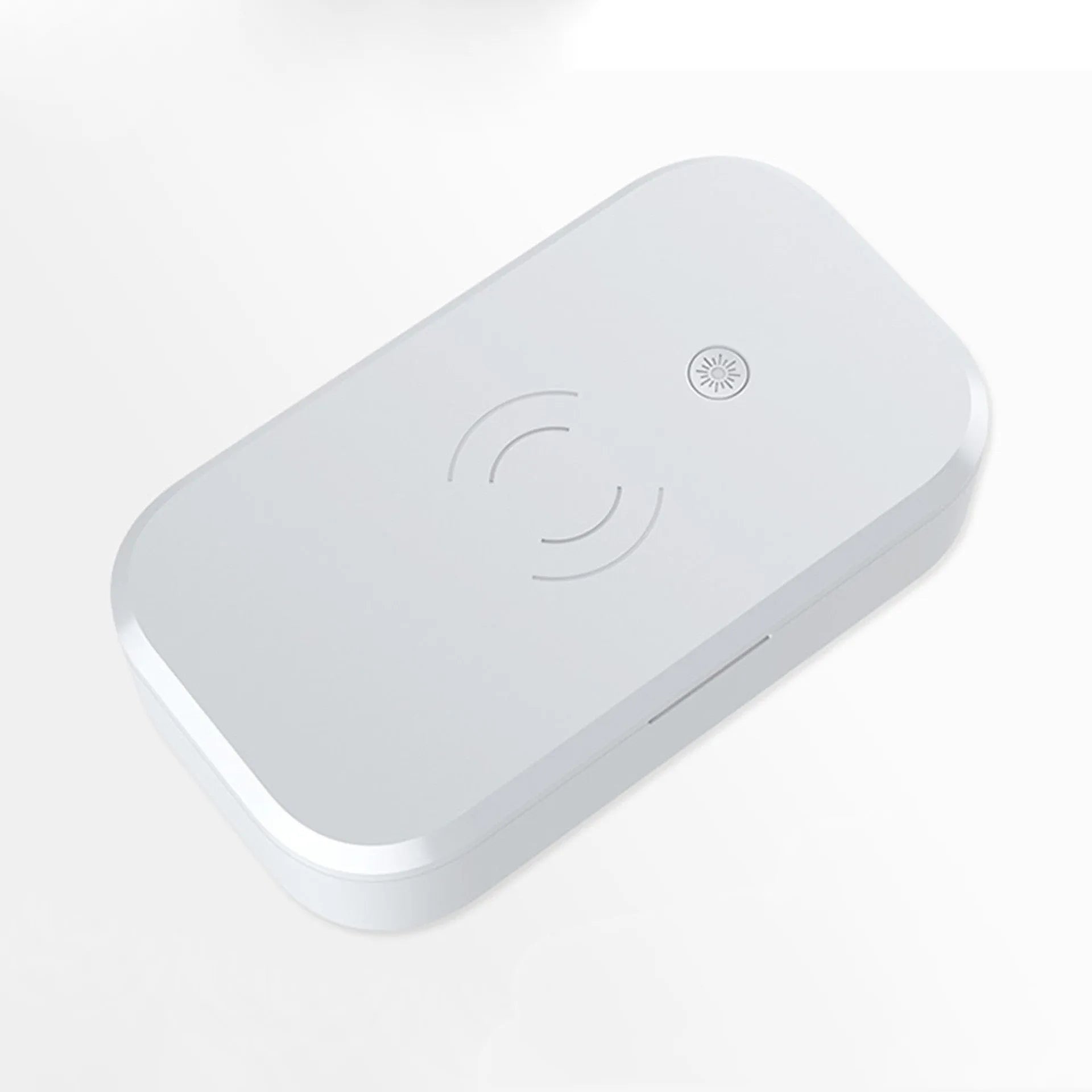 White ultraviolet disinfection box for nail tools with built-in wireless phone charging pad.