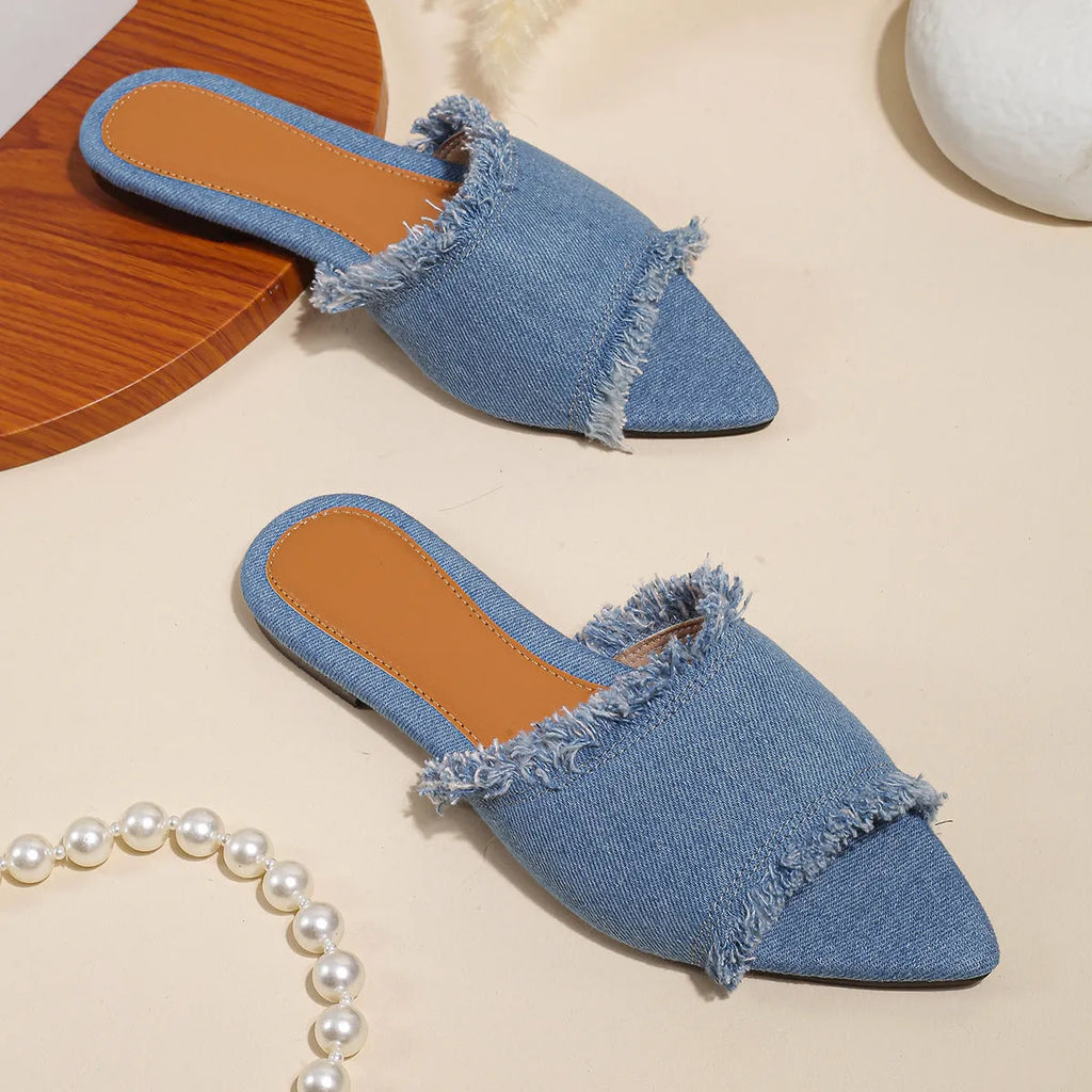 Women's flat denim slippers with tassel detail in apricot colour on a white background