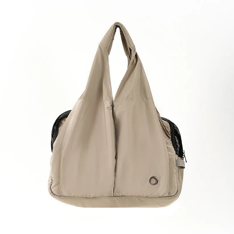Apricot coloured cloth pet handbag measuring 41cm by 16cm by 28cm