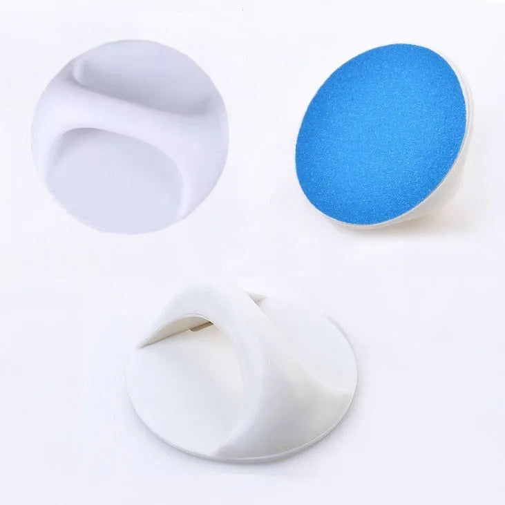 Round dog nail scratch board with ergonomic handle in one of four colours.
