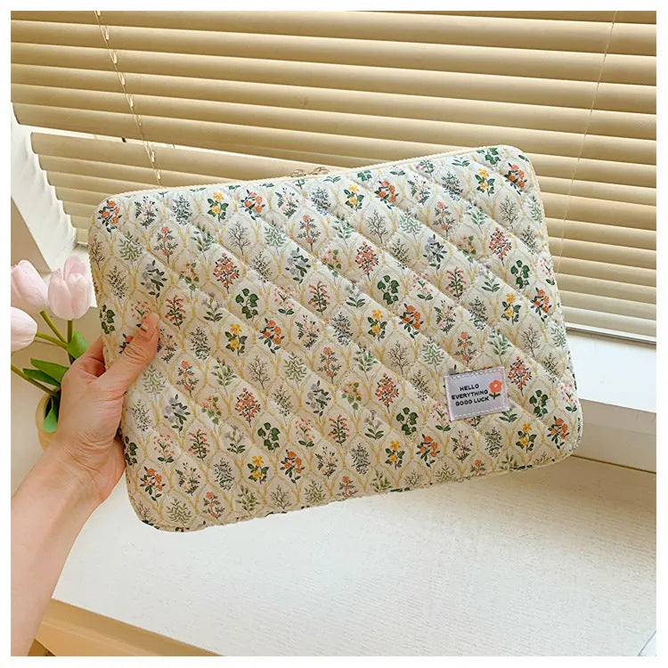 Women's floral print laptop bag in green flower pattern showing storage compartments