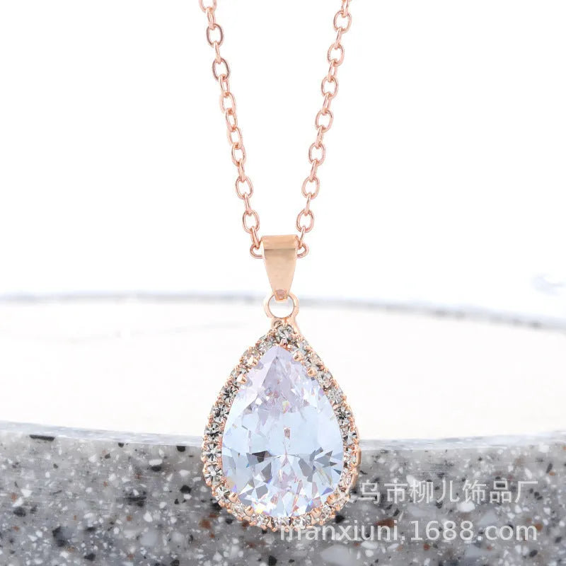 Rose gold plated drop pendant necklace with colourful rhinestones in a pink colour option.