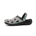 Black women's platform sandals with rhinestone detailing on EVA material