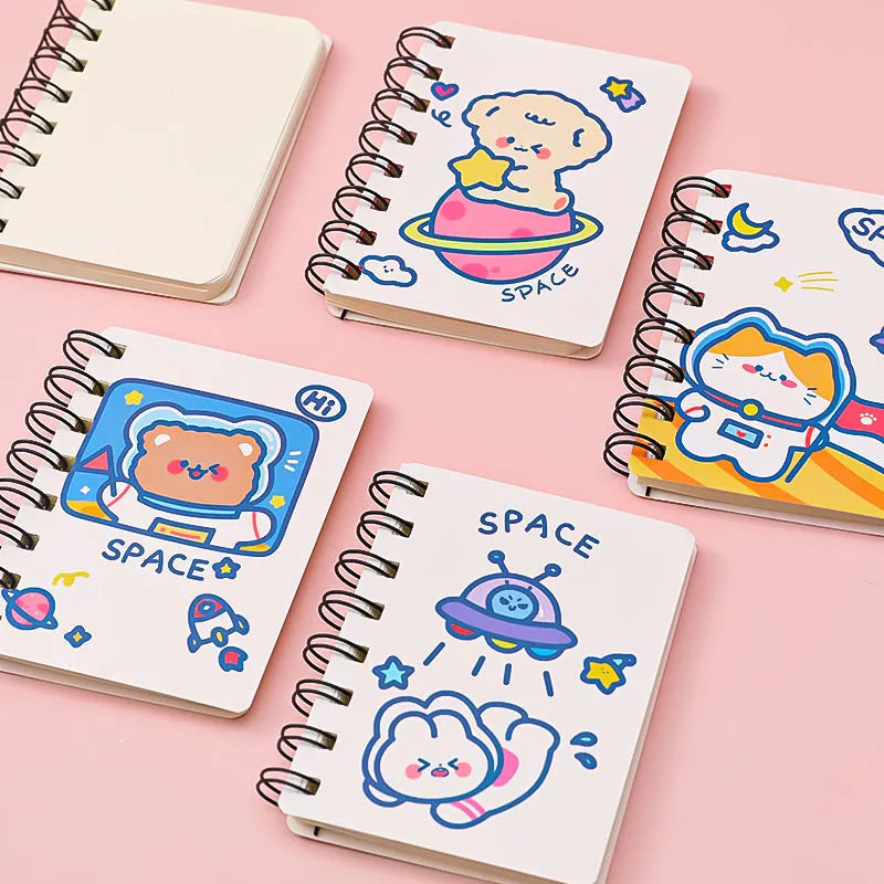 Astronaut themed flipper notebook showing compact 10.5cm by 8cm size with space artwork cover