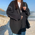 Women's knitted cardigan top coat in black solid colour with long sleeves and loose fit