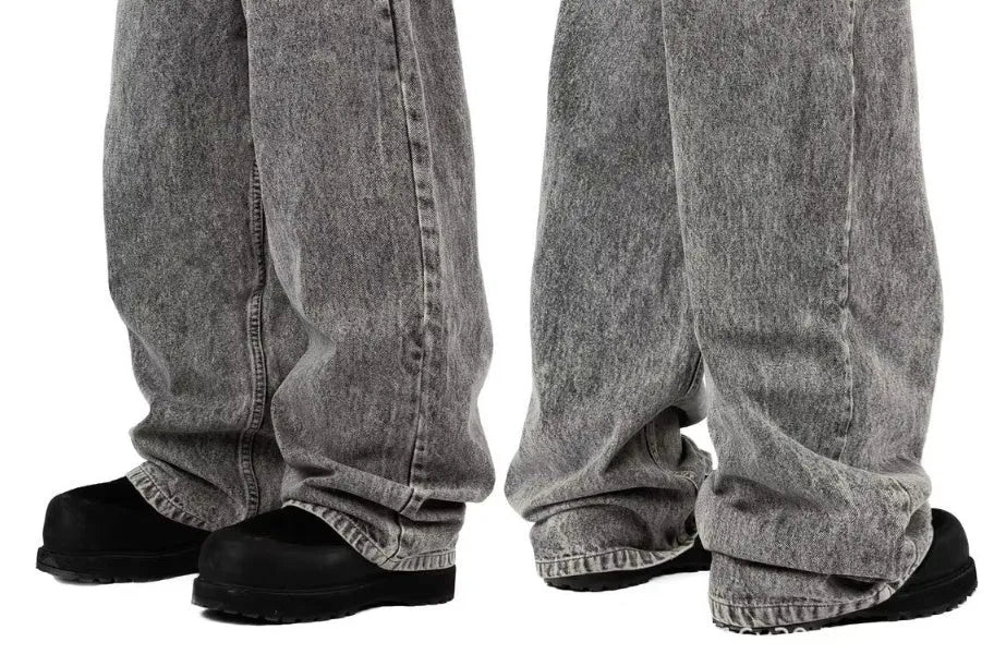 Grey loose fit straight leg denim trousers for men and women laid flat