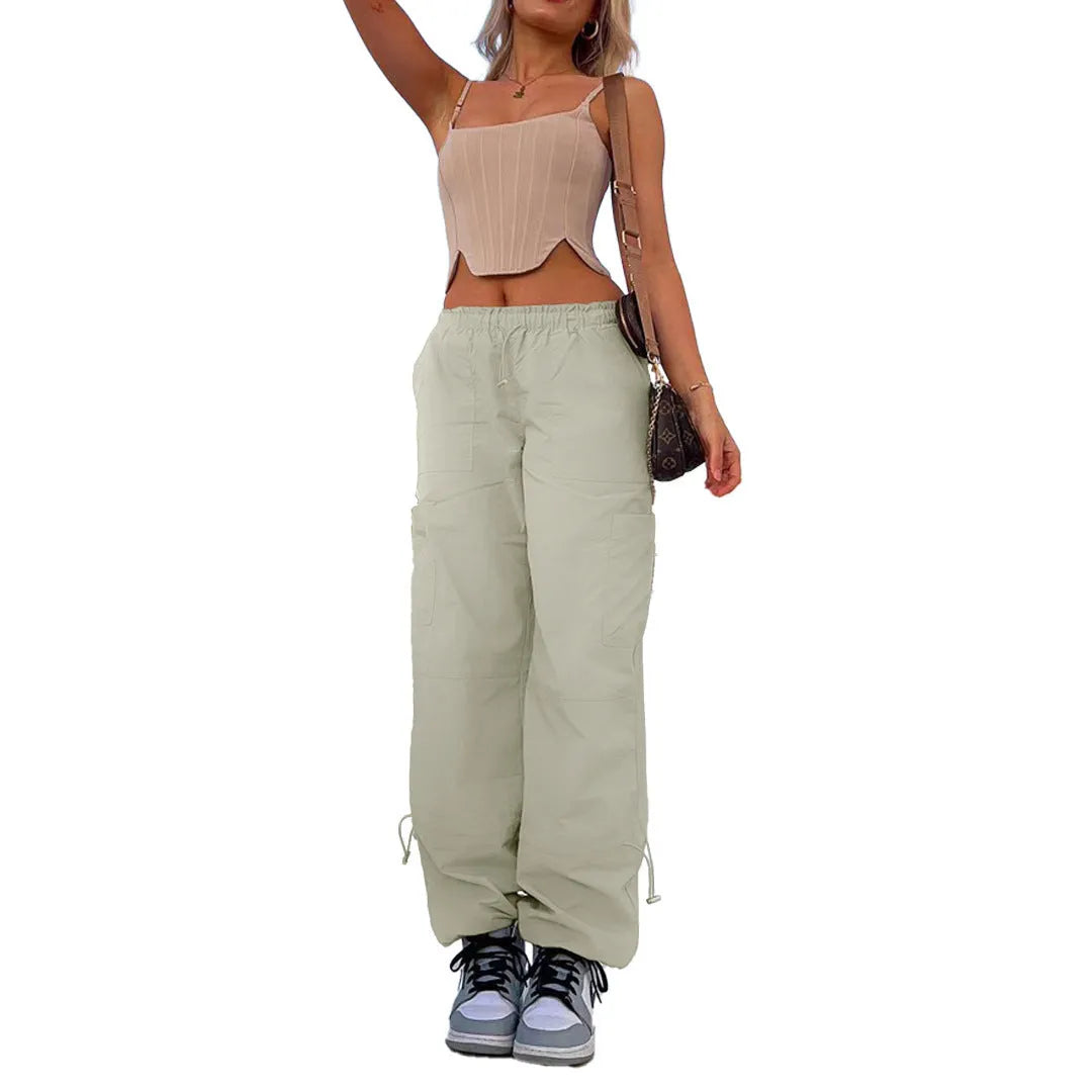Straight-leg loose fit cargo casual pants in grey with multiple pockets, made from polyester fabric.