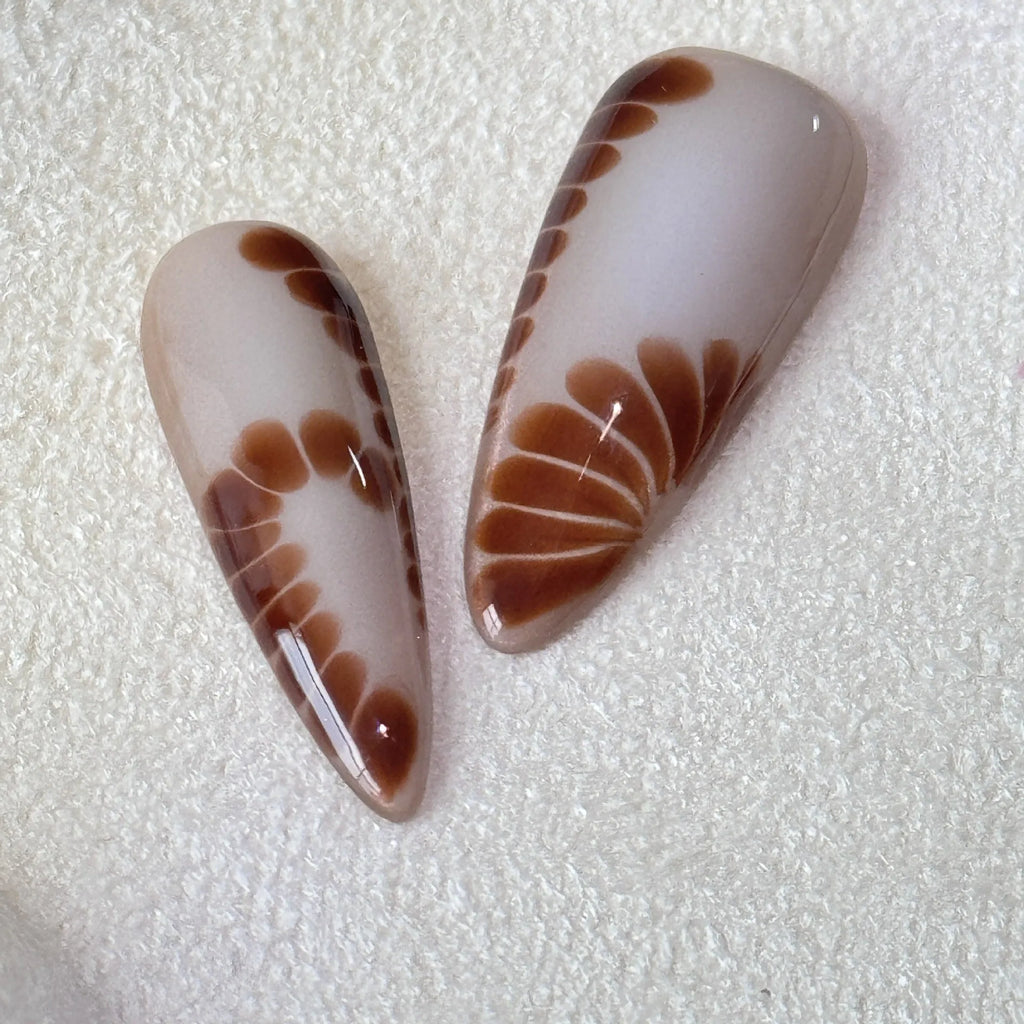 Handmade leopard print false nail stickers with cross and flower designs in sizes XS S M L