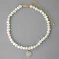 Geometric silver pendant necklace with irregular freshwater pearls on adjustable chain