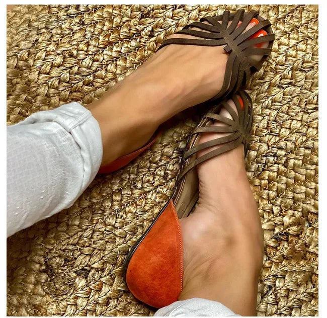 Women's leopard print flat sandals with a square buckle and ankle strap detail.