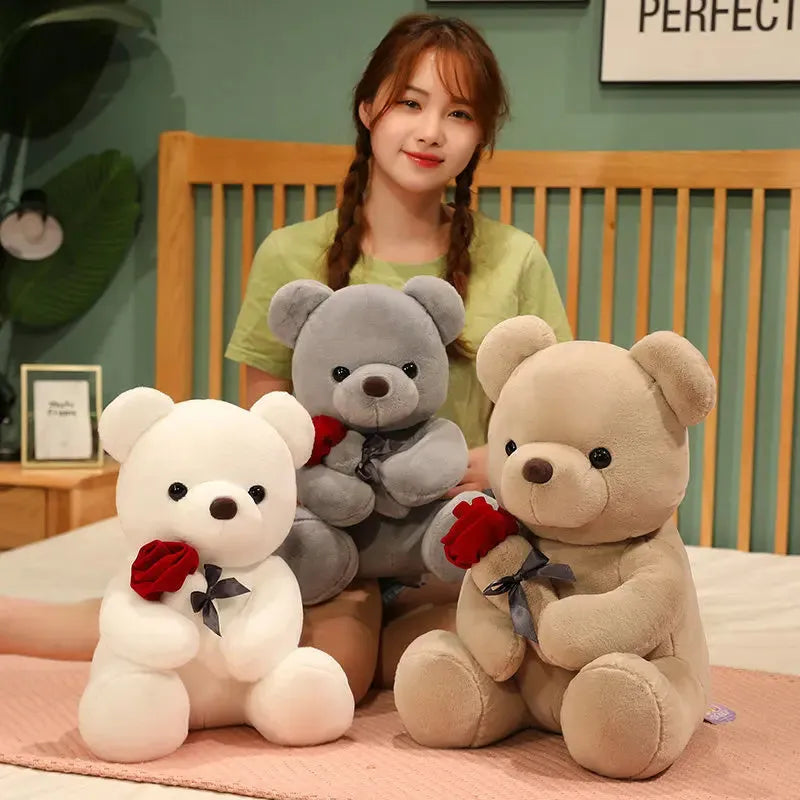 Soft plush Rose Bear teddy bear toy in beige, brown or grey, shown in sizes from 23cm to 45cm.