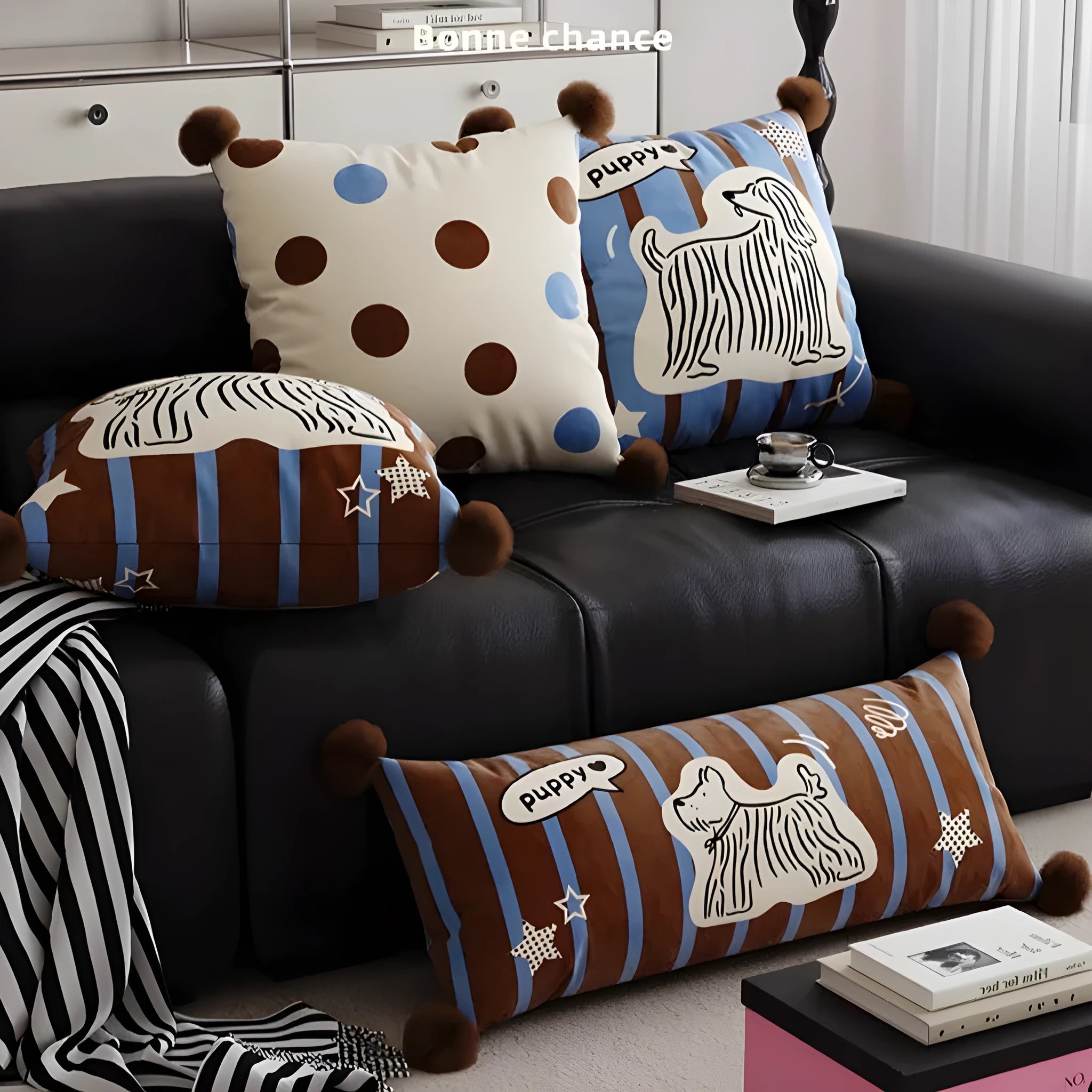 Blue cartoon animal print cushion and matching pillowcase on a sofa