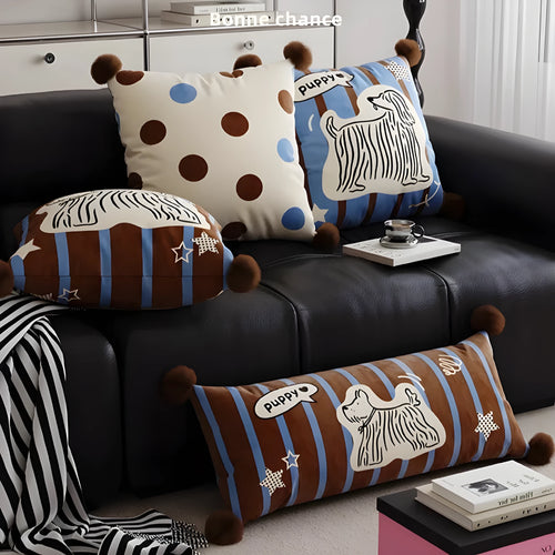 Blue cartoon animal print cushion and matching pillowcase on a sofa