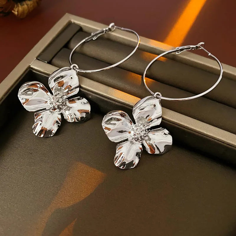 Metal flower geometric earrings with silver needle detail in gold or silver electroplated finish