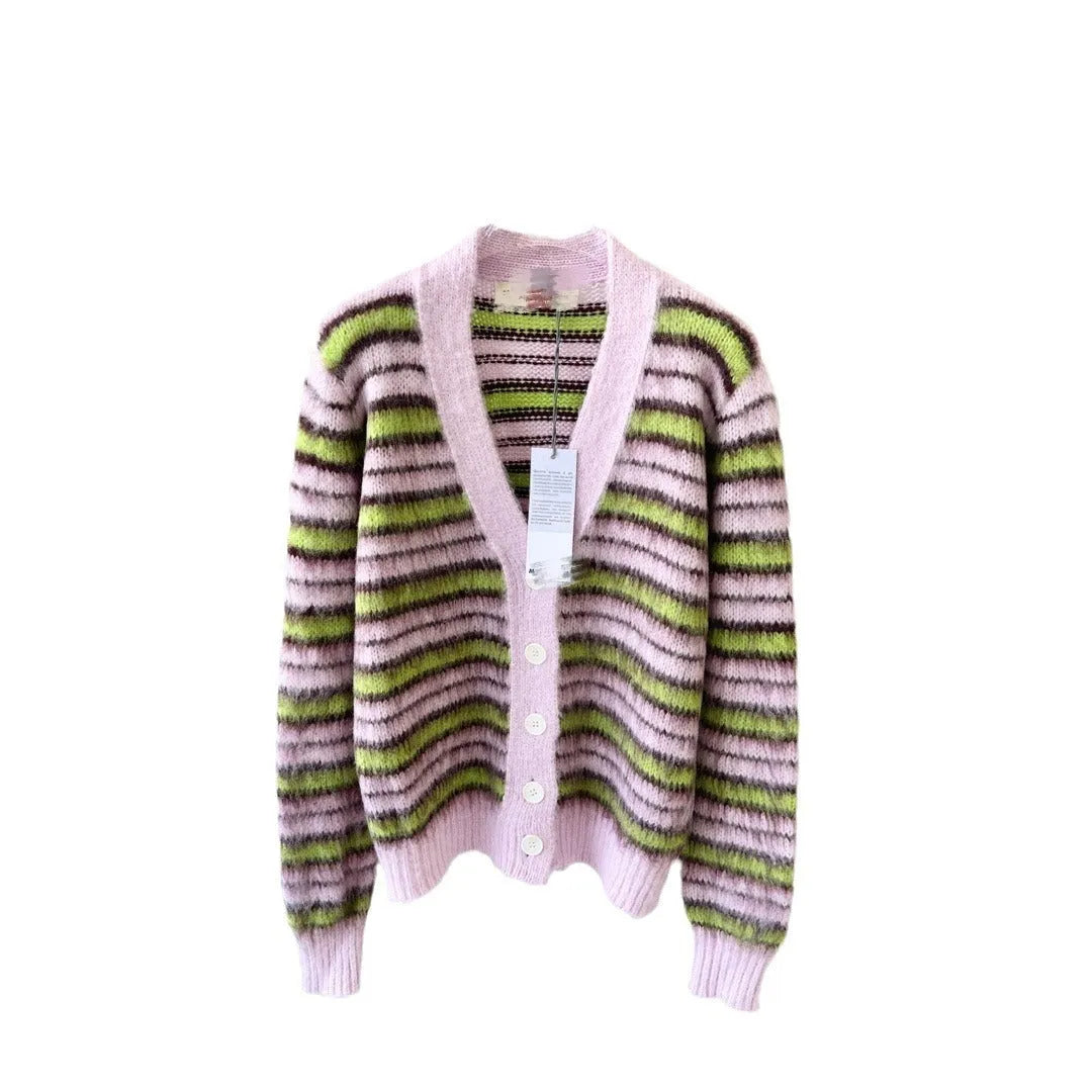 Pink wool lazy coat style cardigan sweater with contrast colour details on a hanger.