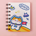 Astronaut themed flipper notebook showing compact 10.5cm by 8cm size with space artwork cover