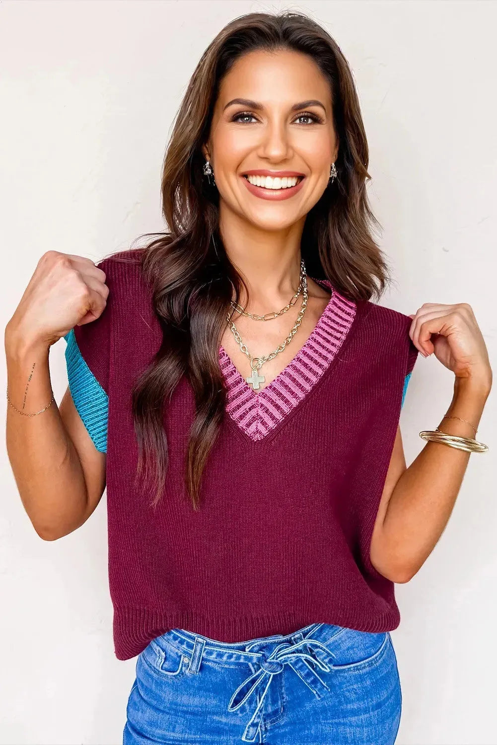 Burgundy women's loose V-neck sweater with contrast trim and cuffed short sleeves.