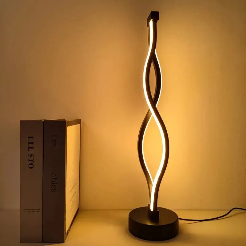 Black aluminium USB desk lamp with three-colour button dimming on a desktop surface