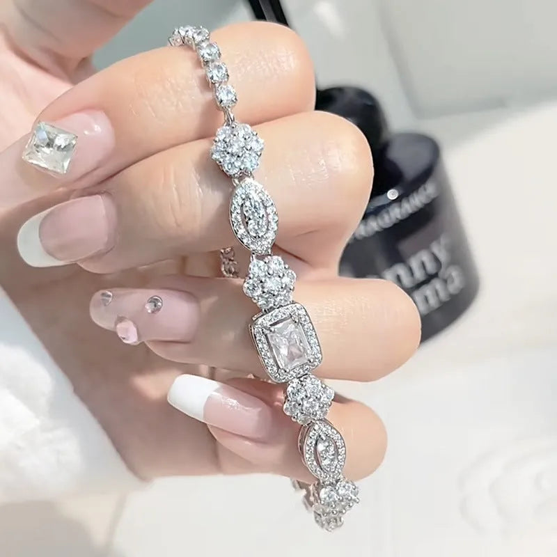Women's geometric bracelet with zircon stones on silver-toned band showing adjustable and fixed length options