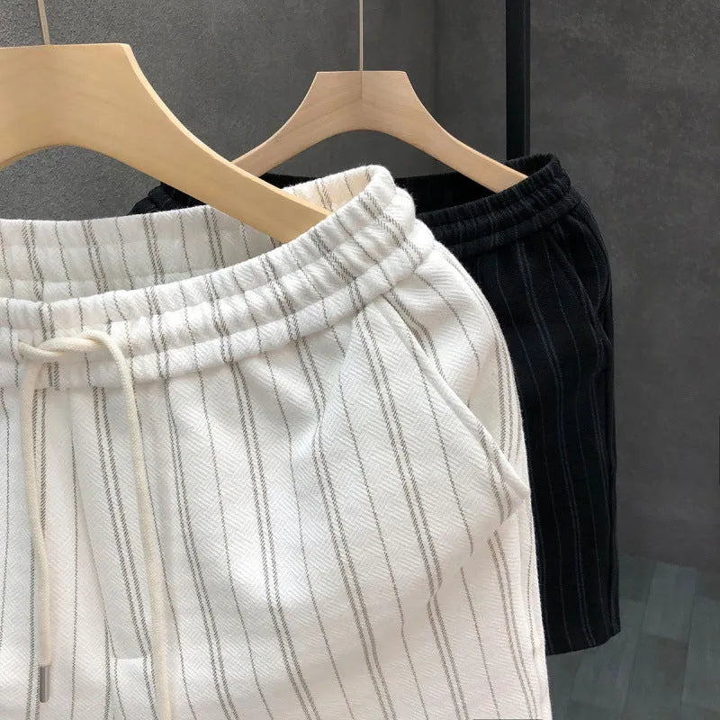 Men's black and white striped fleece-lined casual shorts with a double-layer waistband.
