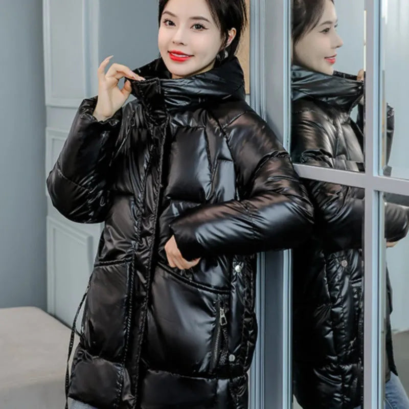 A women's loose-fit hooded winter jacket in a thick padded design, shown in one of four colour options.
